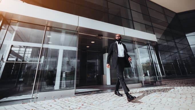 automatic sliding doors with a man walking through