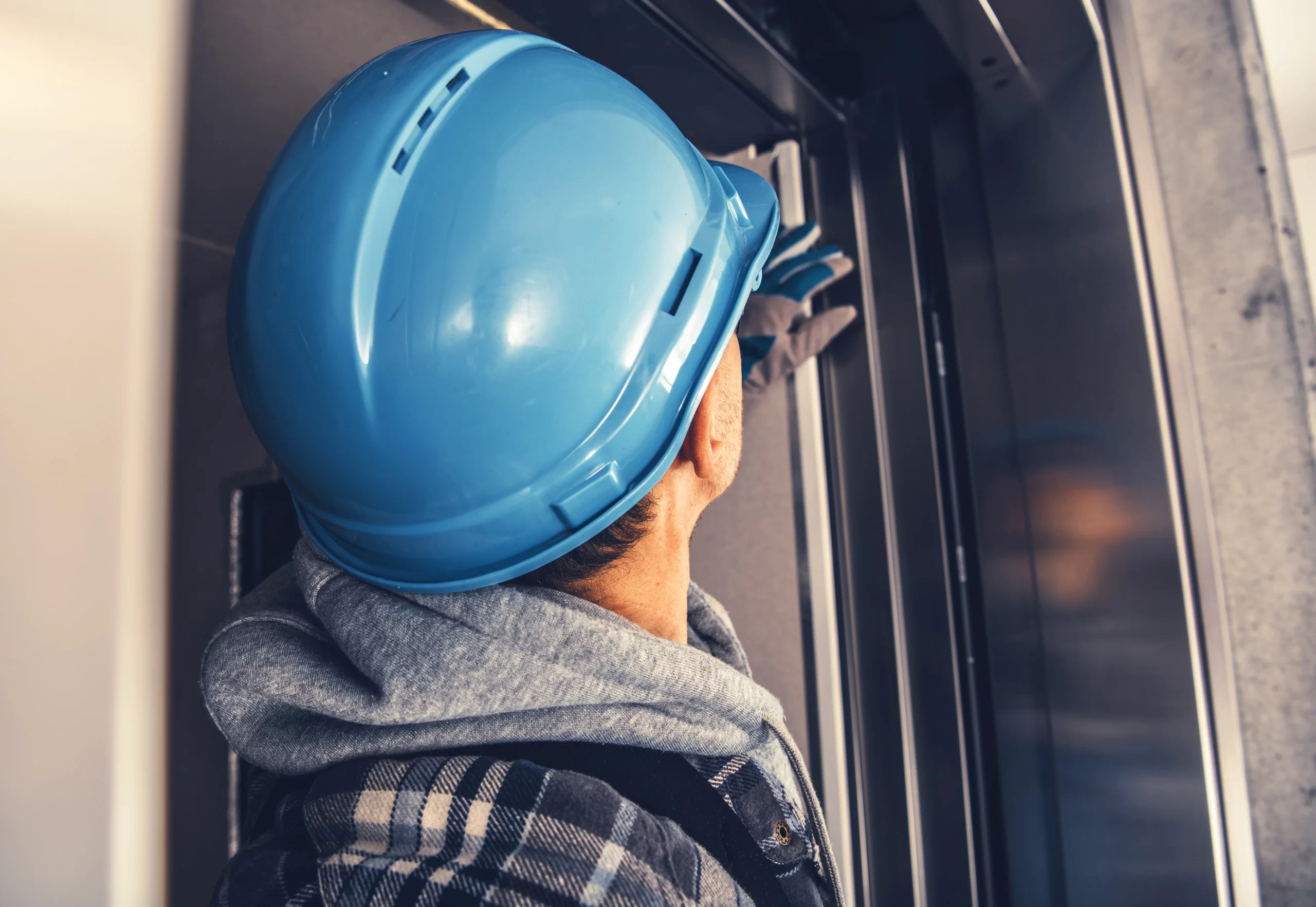 a man learning how to install an automatic door closer