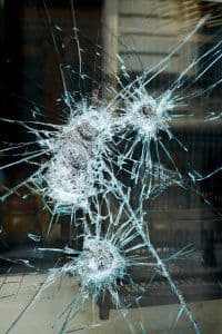 bullet holes smashing glass