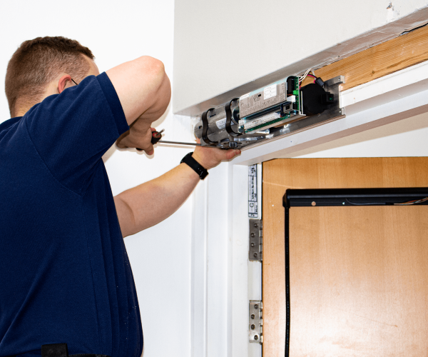 an automatic door servicing taking place